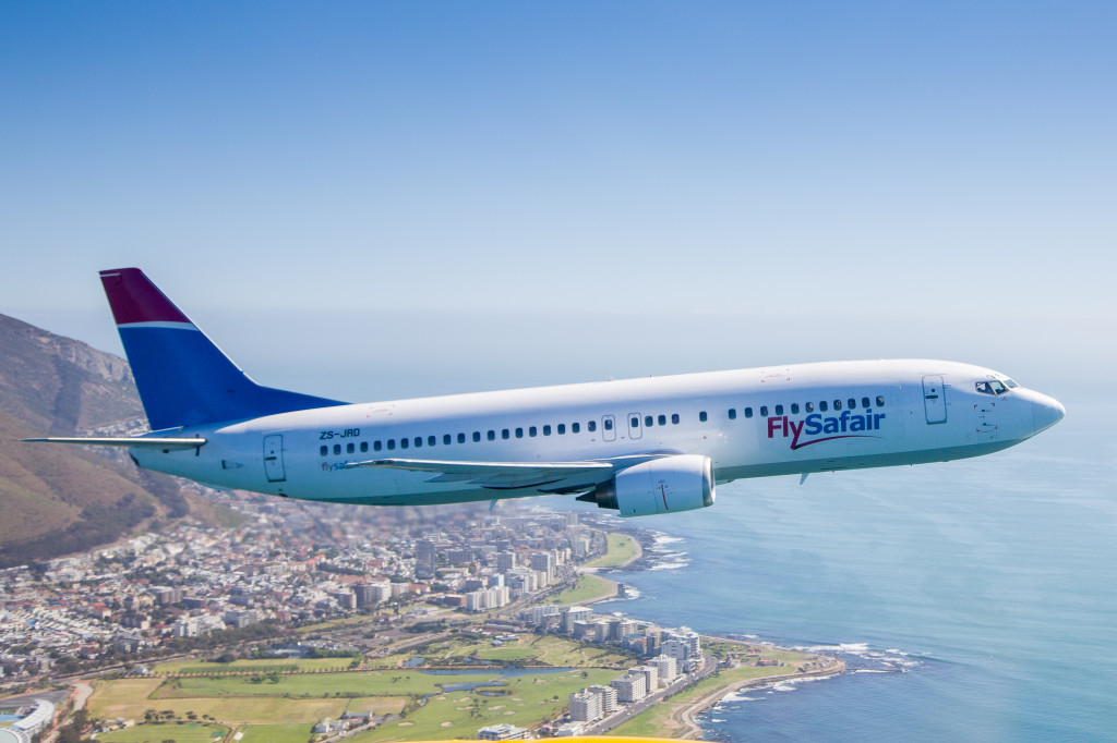 flysafair aircraft flying over cape town